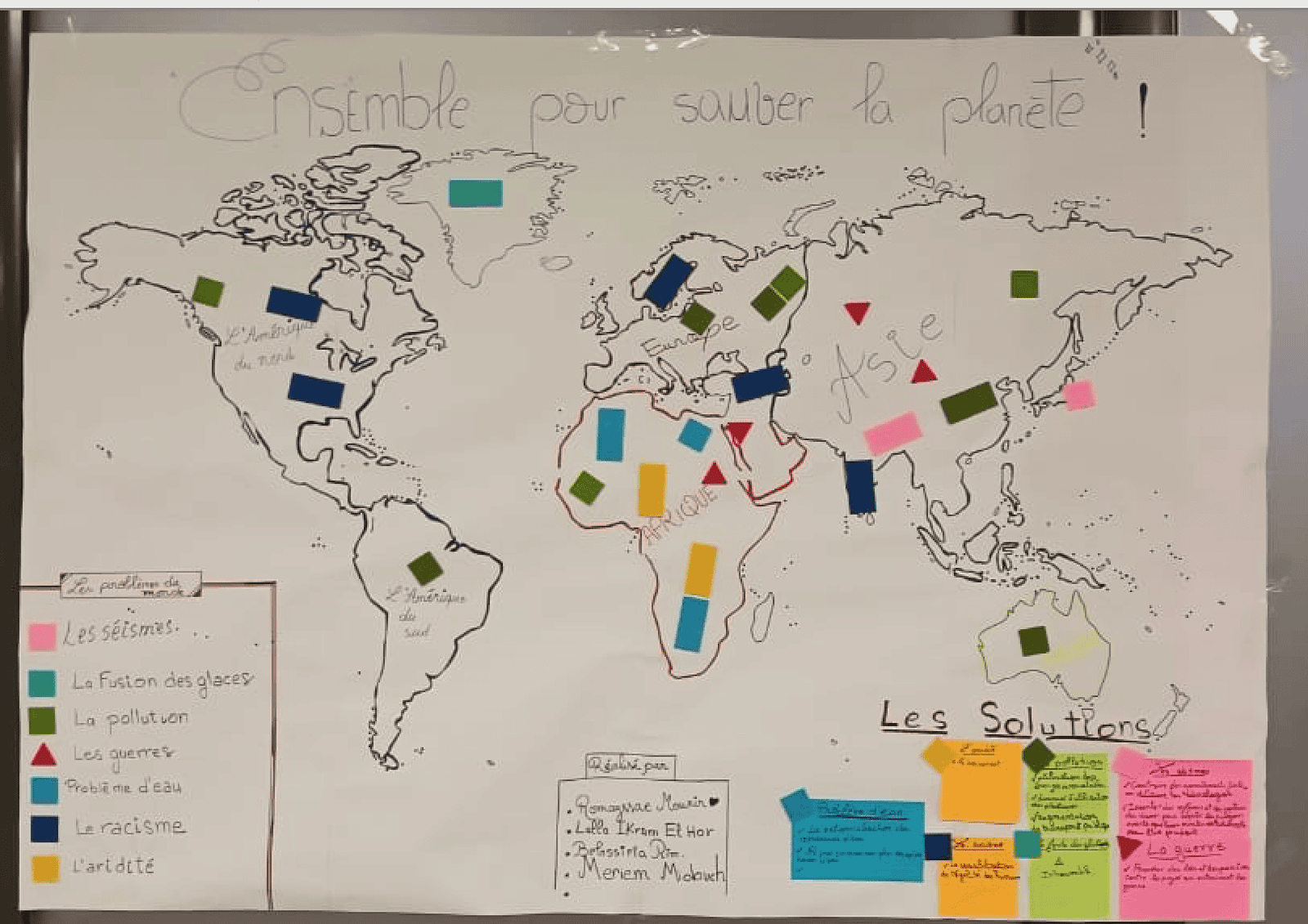 tep-student-world-map-global-issues-solutions-lycee-morocco-2026 Student-created world map titled "Ensemble pour sauver la planète" (Together to Save the Planet), with colour-coded markers identifying global problems including pollution, wars, racism, water scarcity and drought across continents, alongside proposed solutions, created during a Transformative-Emancipatory Pedagogy (TEP) session at Lycée Mohammed VI d'Excellence, Morocco, 2026.